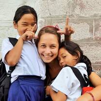 Volunteer with children in Nepal