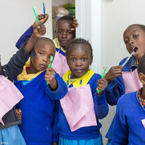 Global Dental Relief Kenya  kids smiling with toothbrushes