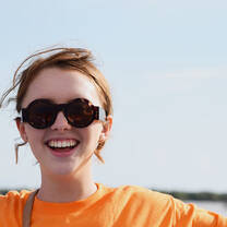 Volunteer smiling at floating village