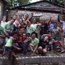 group of volunteers in front of building