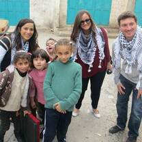 Volunteers with children in Palestine
