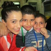 Volunteer with children in Palestine