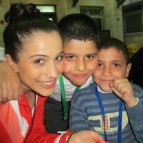 Volunteer with children in Palestine