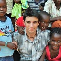 Volunteer with children in Uganda