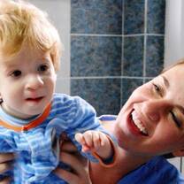 Volunteer with a child in the orphanage in Romania