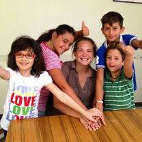Volunteer playing with the children in Italy