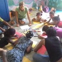 Children participate in a team building exercise during camps.