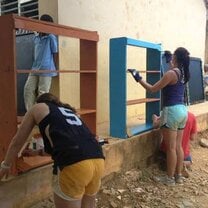 Building and painting shelves at one of the local public schools.