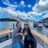 Two girls smiling on a boat in Queenstown