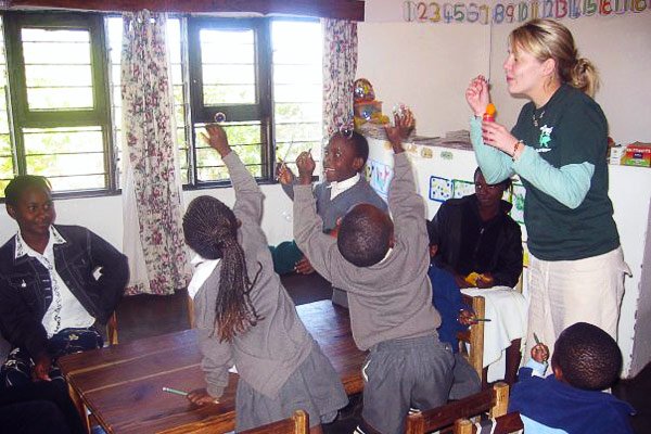 Anna playing with bubbles with her students