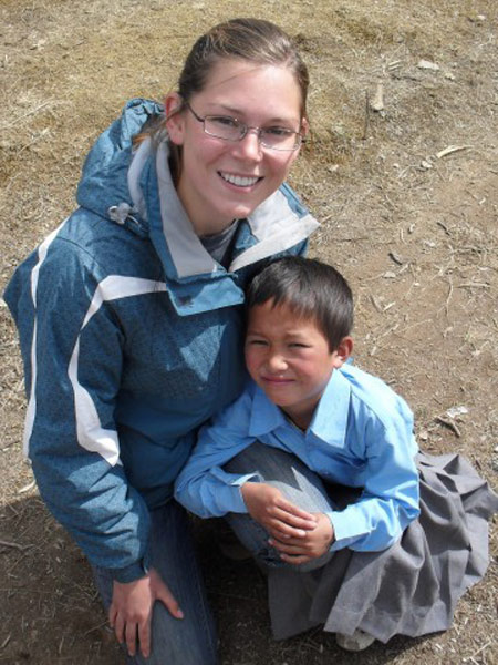 Carrie with children at a boarding school