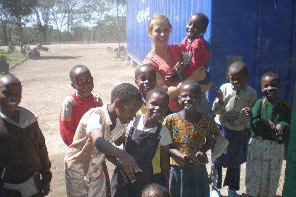 group of children in Tanzania with a volunteer
