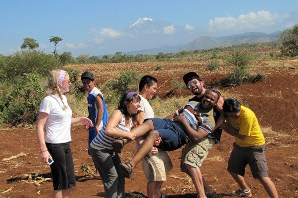 MAD volunteers in Tanzania in front of Mt. Kilimanjaro