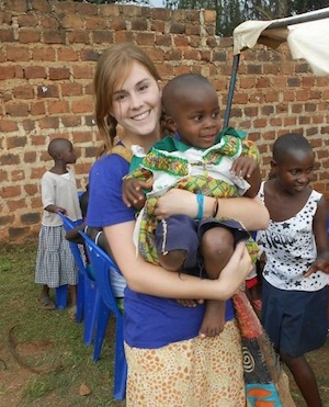 Volunteer holding a child